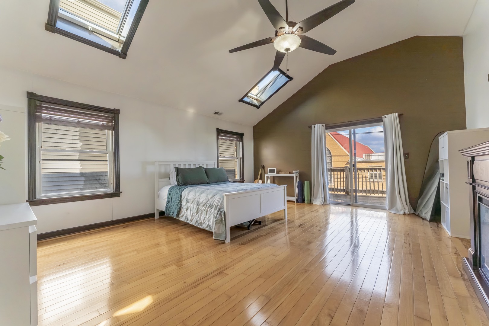 5454 West Eddy Street Chicago, IL 60641 - Photo 13 of 22 a spacious bedroom with a bed dresser and a window