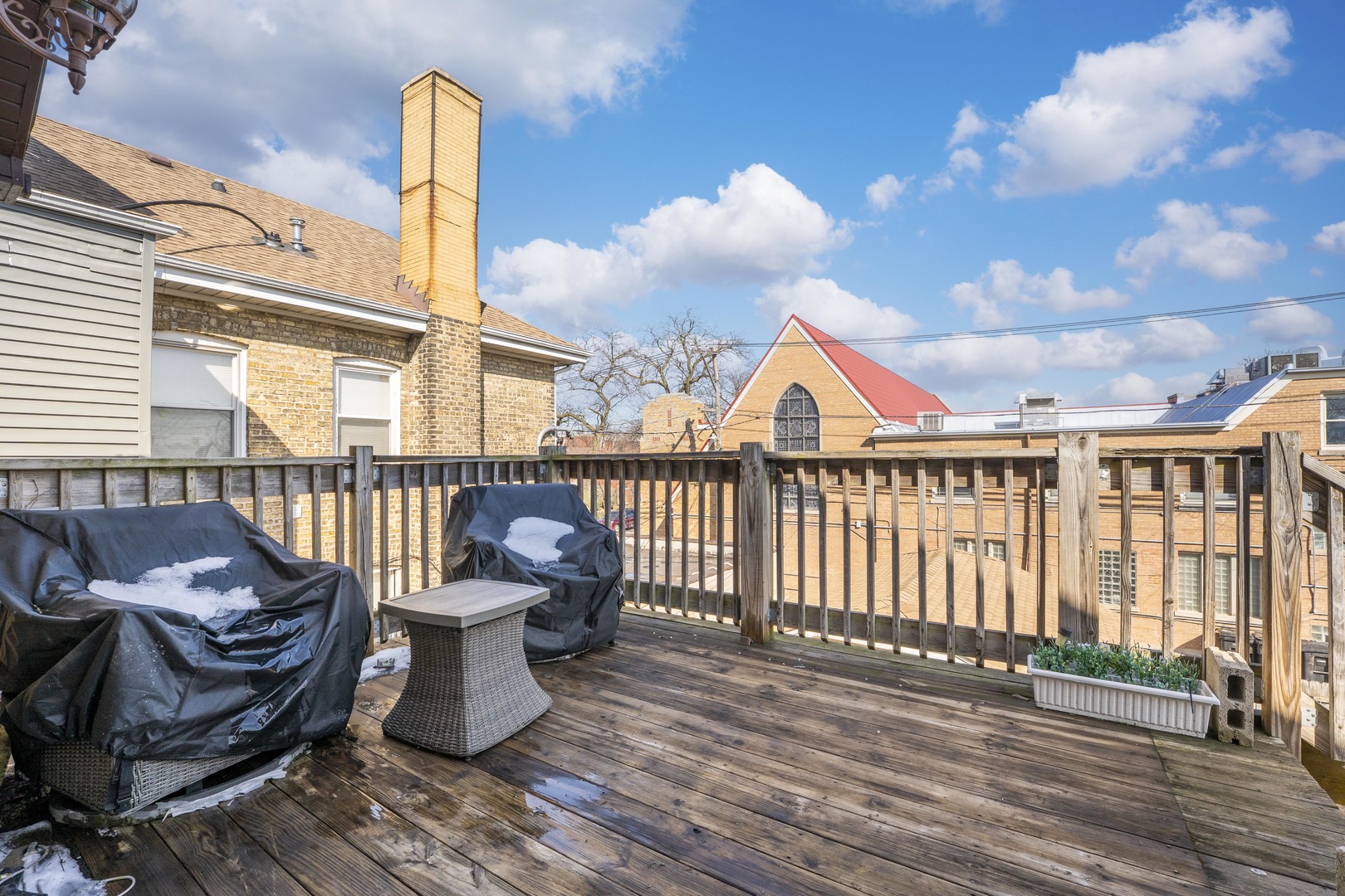 5454 West Eddy Street Chicago, IL 60641 - Photo 15 of 22 a roof deck with wooden floor and outdoor seating