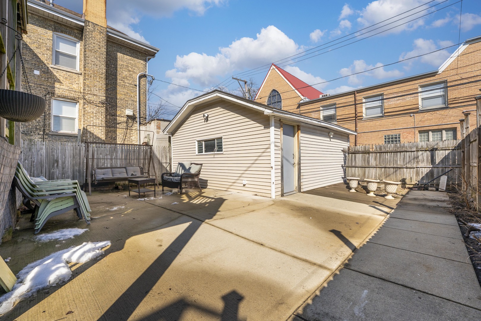 5454 West Eddy Street Chicago, IL 60641 - Photo 21 of 22 a view of a patio with a table and chairs