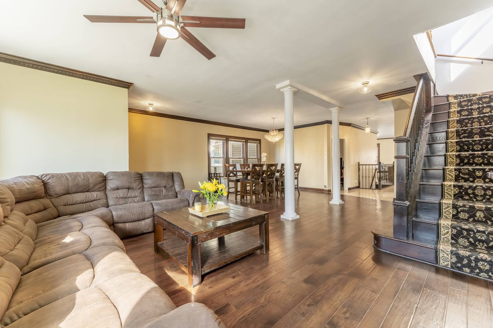 5454 West Eddy Street Chicago, IL 60641 - Photo 3 of 22 a living room with couches and a coffee table with wooden floor