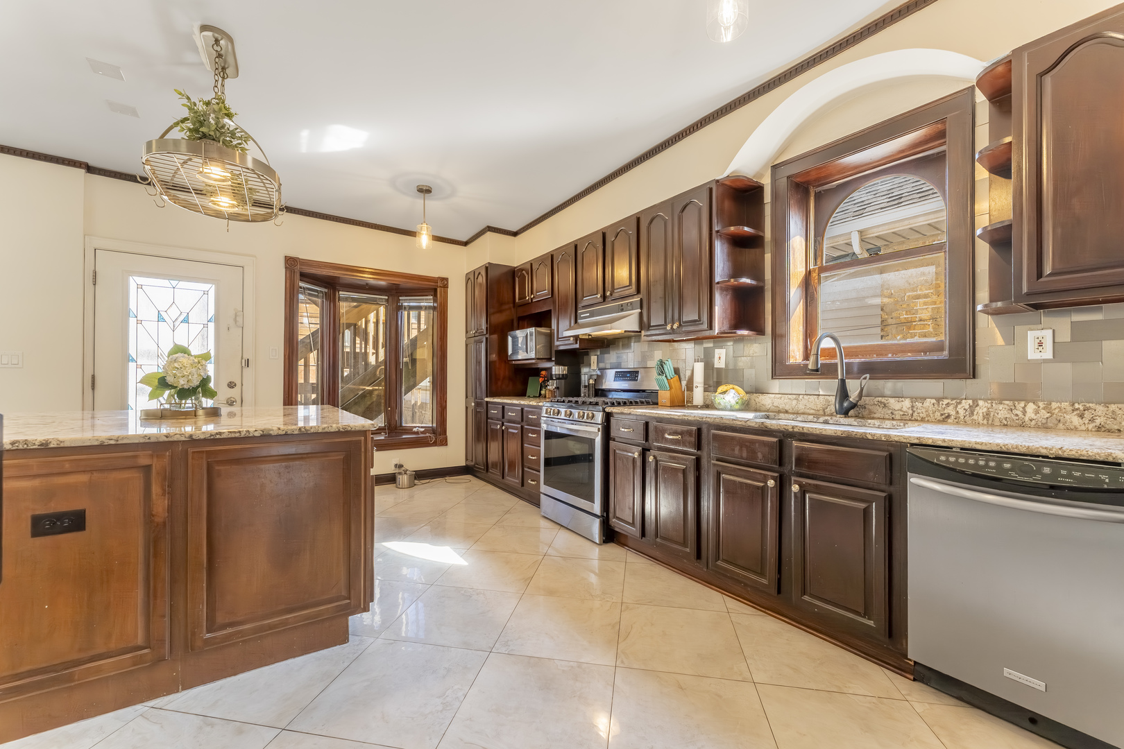 5454 West Eddy Street Chicago, IL 60641 - Photo 5 of 22 a large kitchen with lots of counter space and a sink