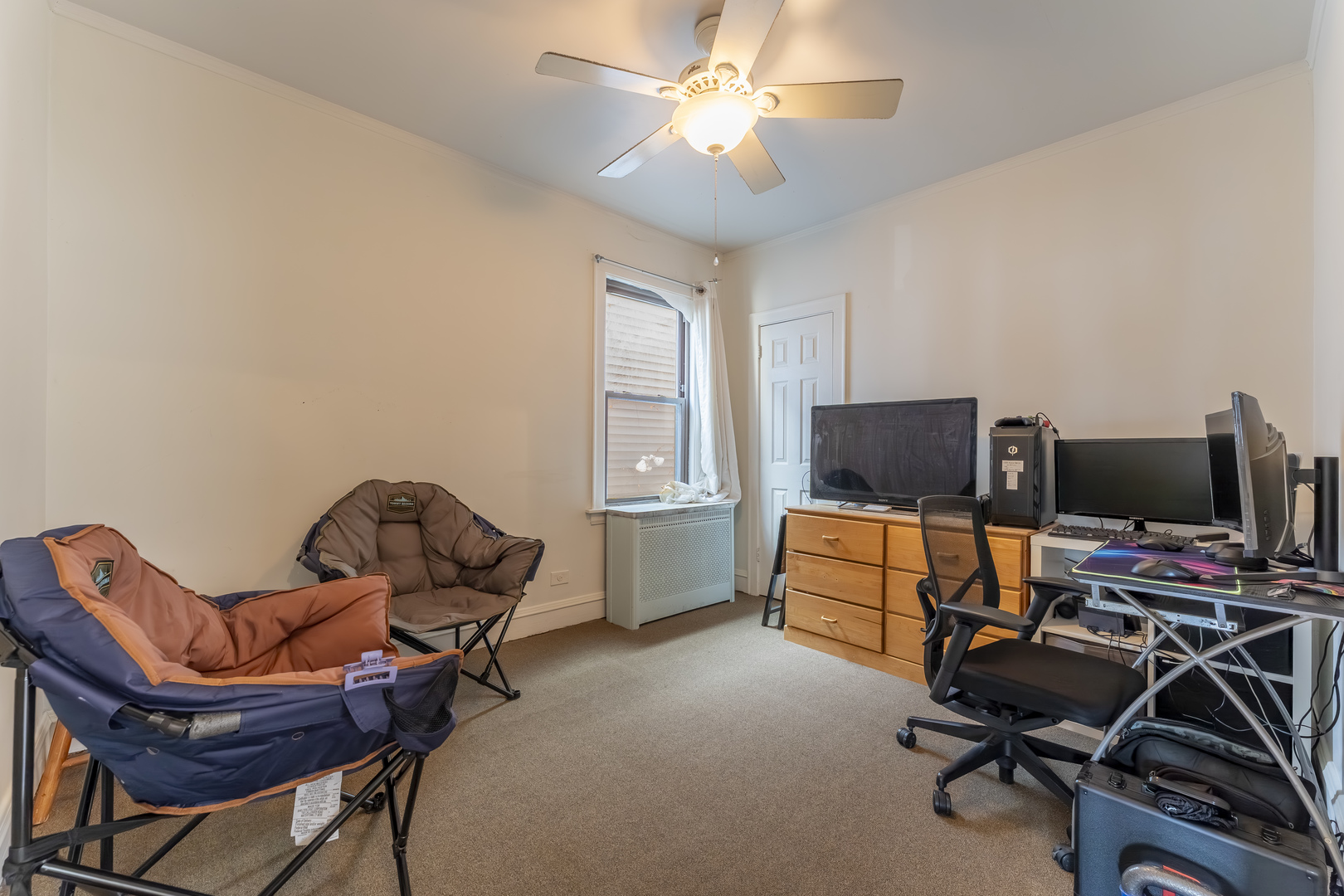 5454 West Eddy Street Chicago, IL 60641 - Photo 9 of 22 a view of a workspace with furniture and a window