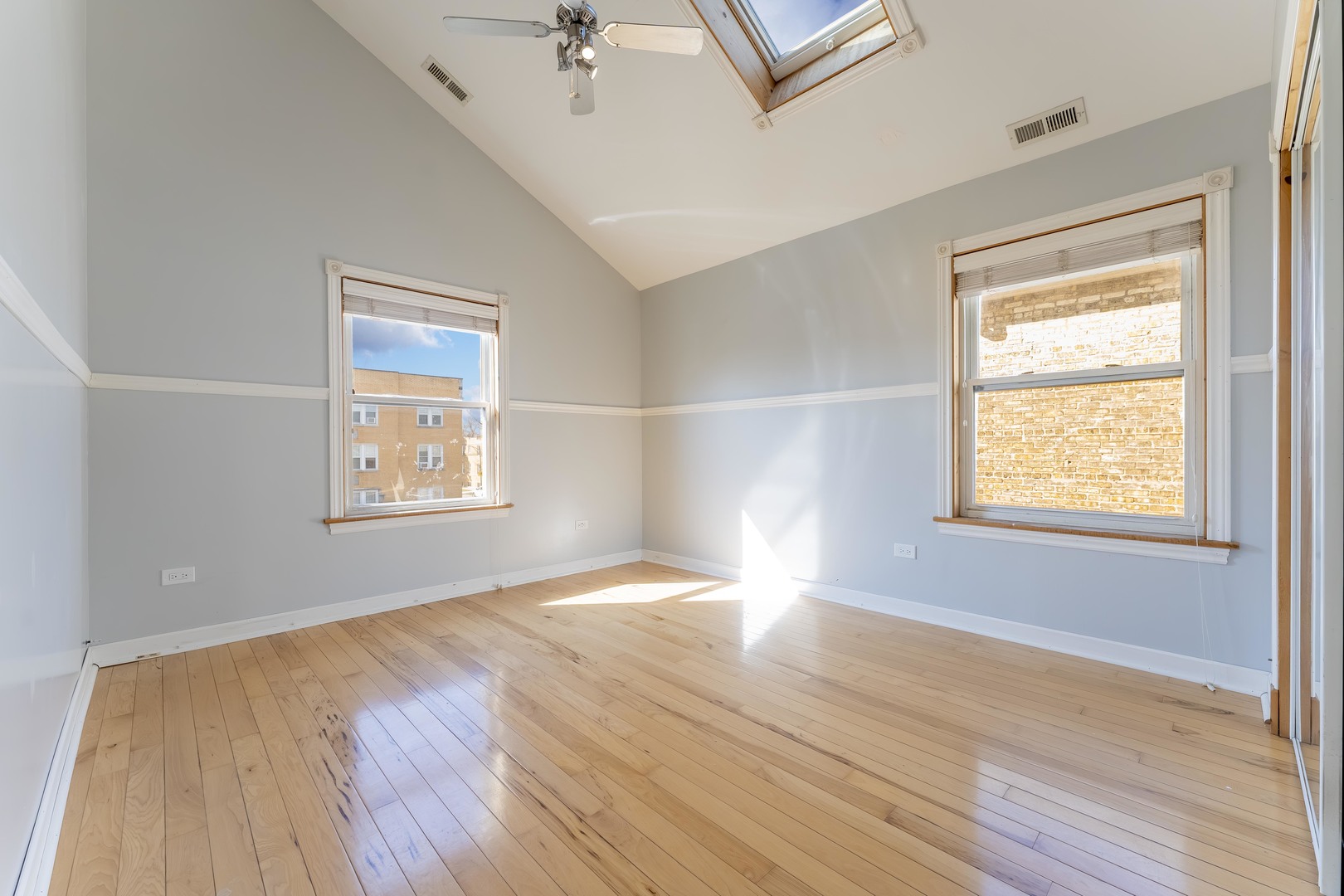 5454 West Eddy Street Chicago, IL 60641 - Photo 10 of 22 wooden floor in an empty room with a window