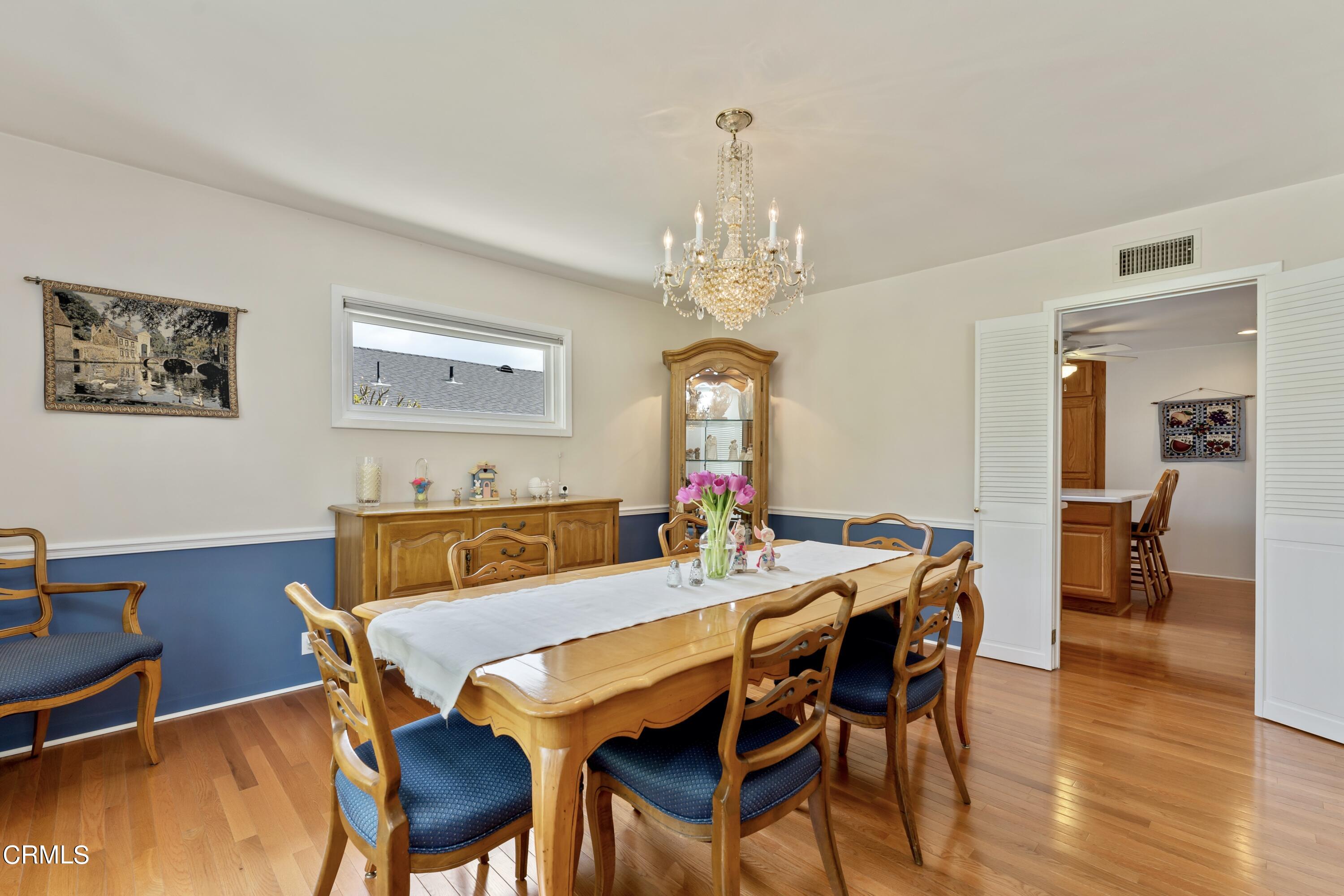 3850 Shadow Grove Road Pasadena, CA 91107 - Photo 14 of 53 a view of a dining room with furniture and wooden floor