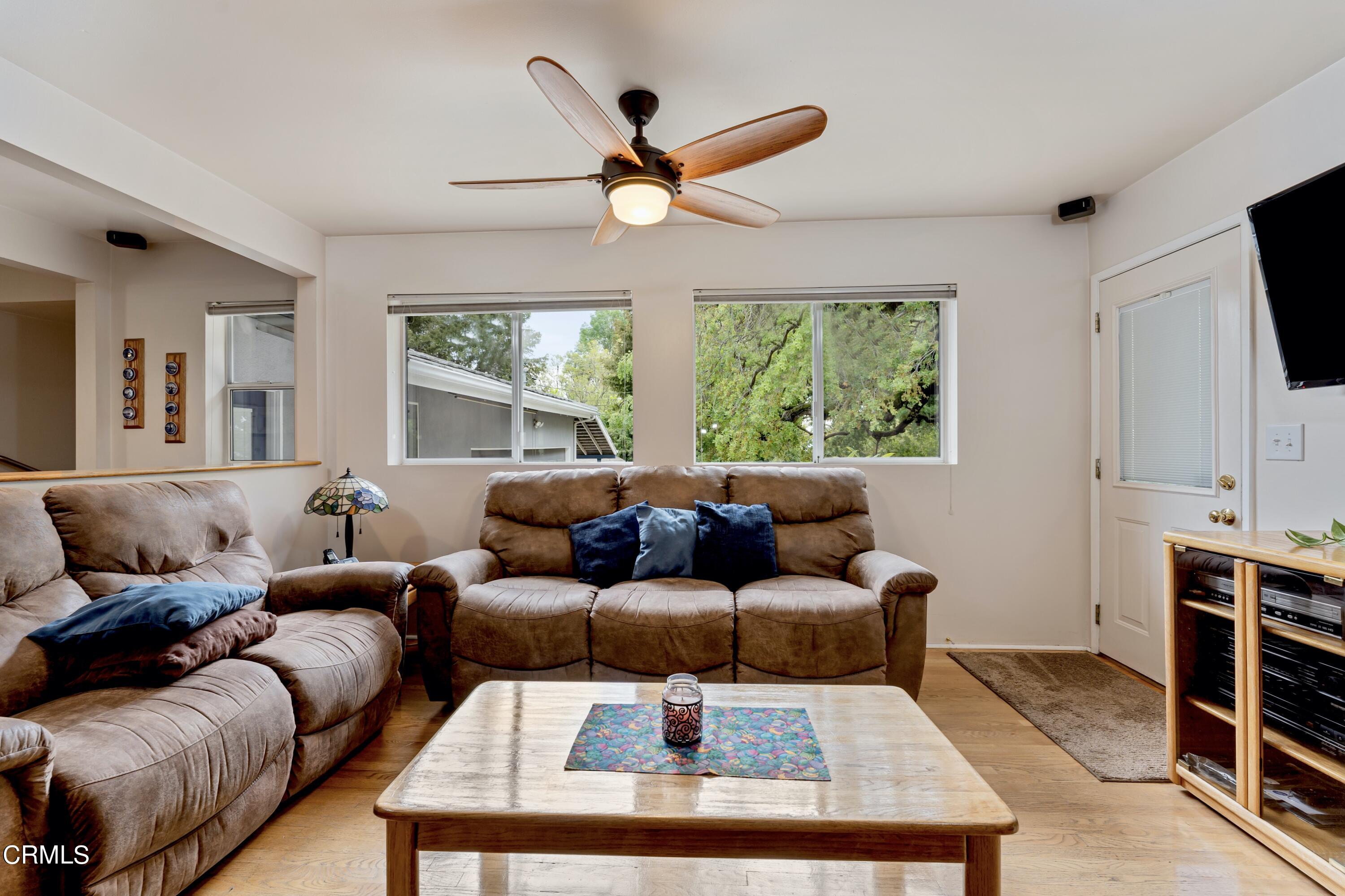 3850 Shadow Grove Road Pasadena, CA 91107 - Photo 19 of 53 a living room with furniture a window and a ceiling fan