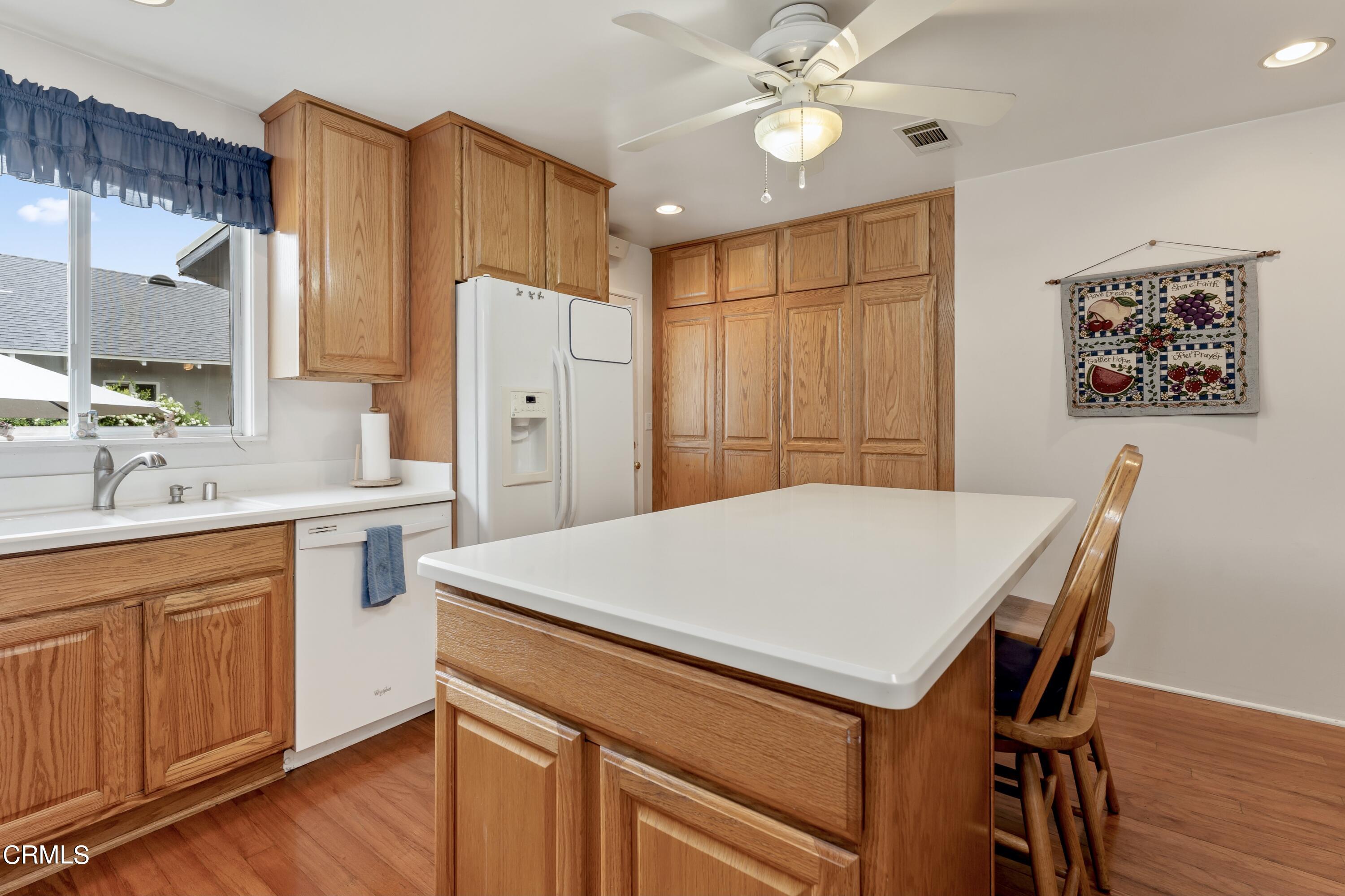 3850 Shadow Grove Road Pasadena, CA 91107 - Photo 21 of 53 a kitchen that has a cabinets a sink and appliances