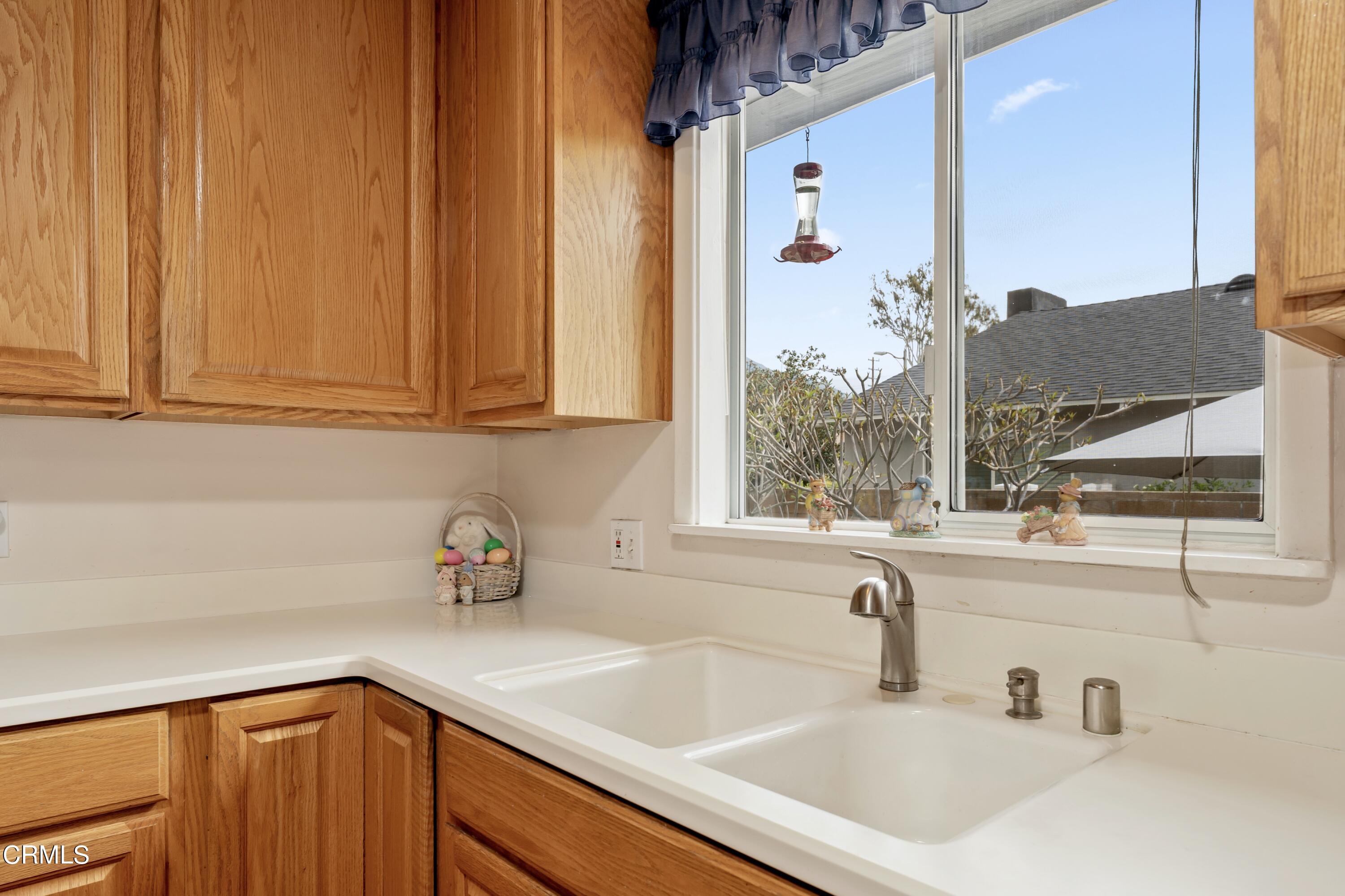3850 Shadow Grove Road Pasadena, CA 91107 - Photo 22 of 53 a kitchen with stainless steel appliances a sink window and cabinets