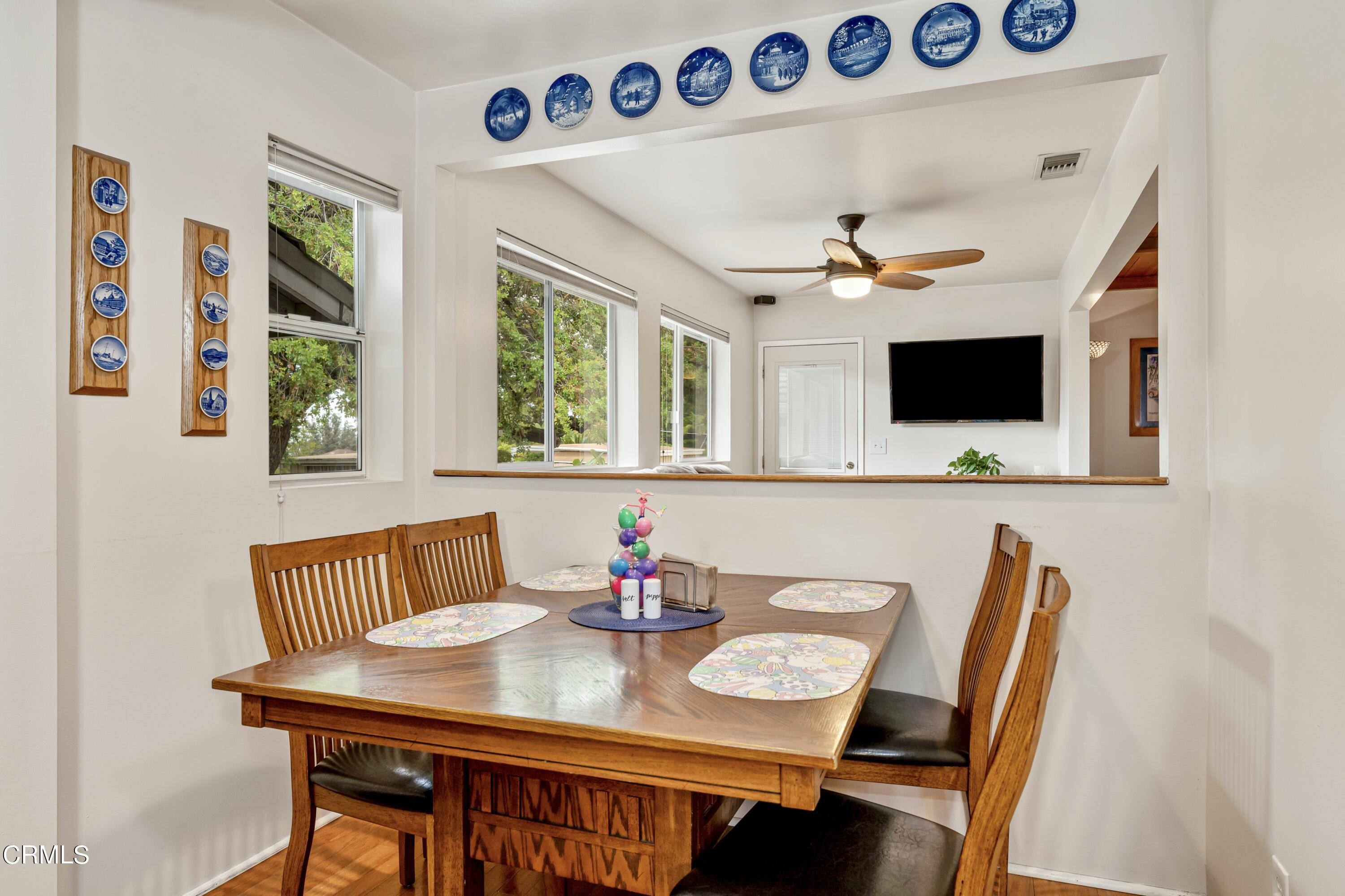 3850 Shadow Grove Road Pasadena, CA 91107 - Photo 25 of 53 a view of a dining room with furniture and a flat screen tv