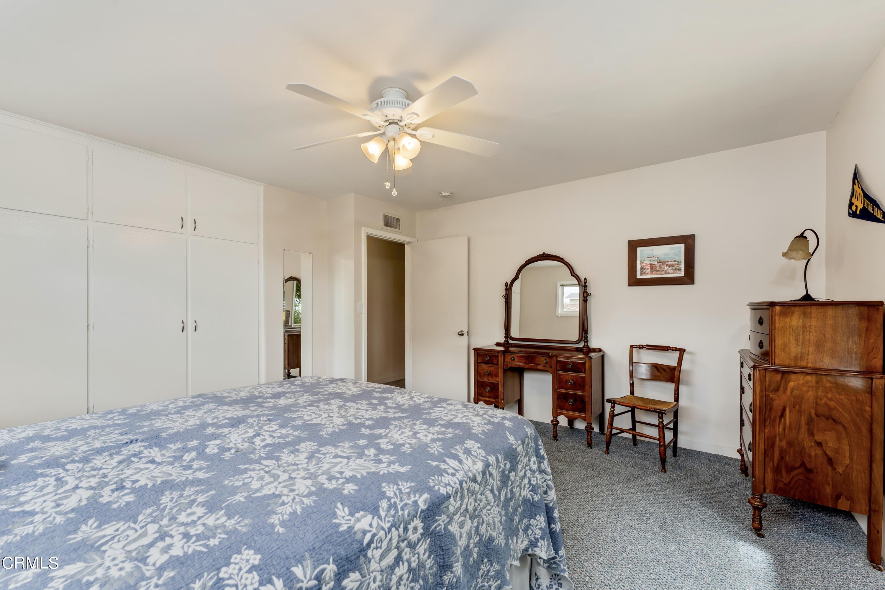 3850 Shadow Grove Road Pasadena, CA 91107 - Photo 26 of 53 a bedroom with a bed and a desk