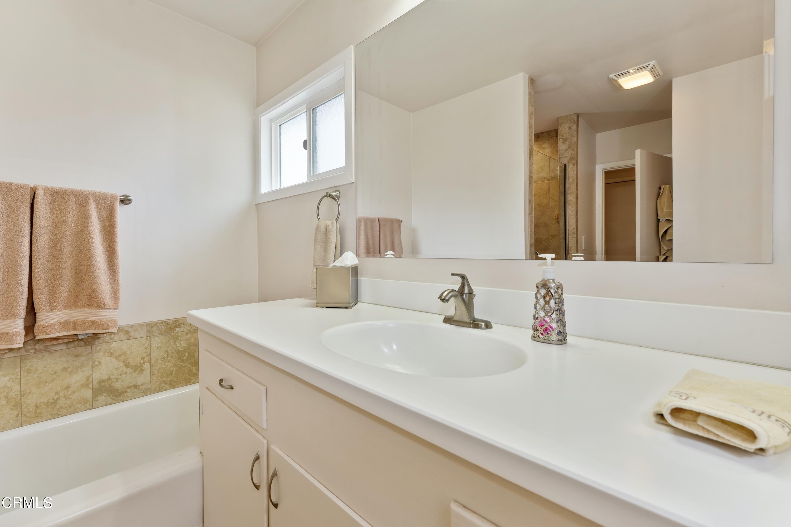 3850 Shadow Grove Road Pasadena, CA 91107 - Photo 29 of 53 a bathroom with a sink and a bathtub
