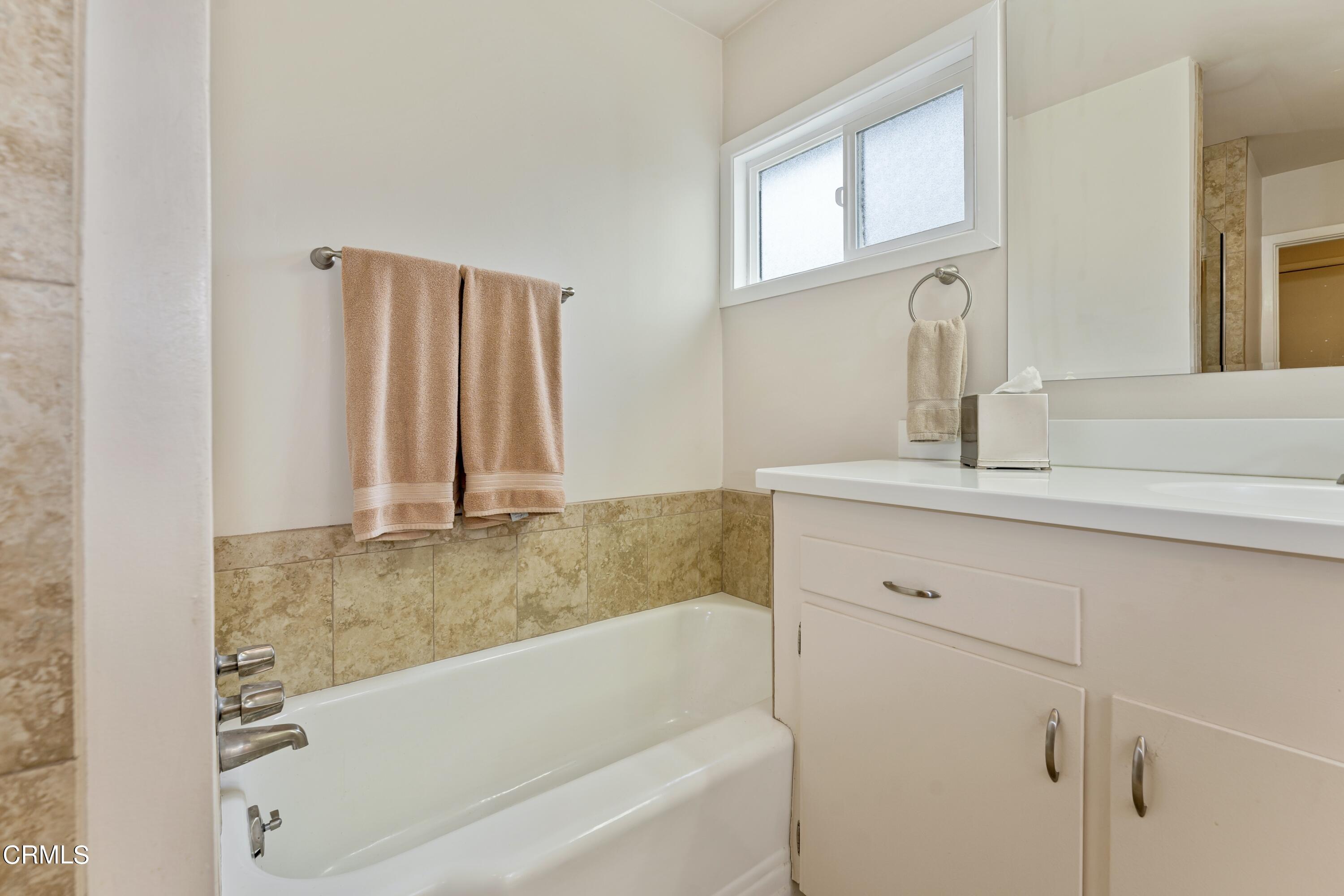 3850 Shadow Grove Road Pasadena, CA 91107 - Photo 30 of 53 a bathroom with a bathtub and a sink