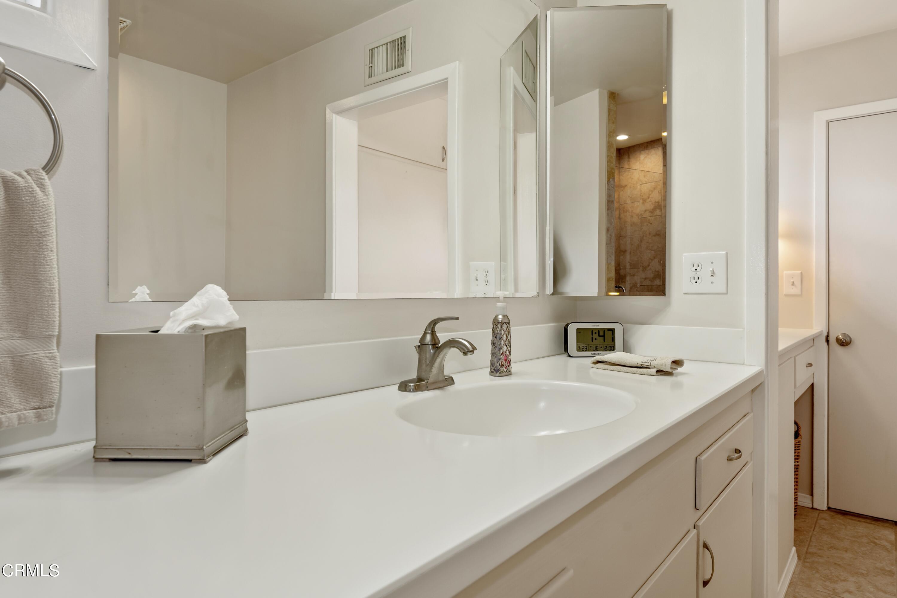3850 Shadow Grove Road Pasadena, CA 91107 - Photo 31 of 53 a bathroom with a sink and a mirror