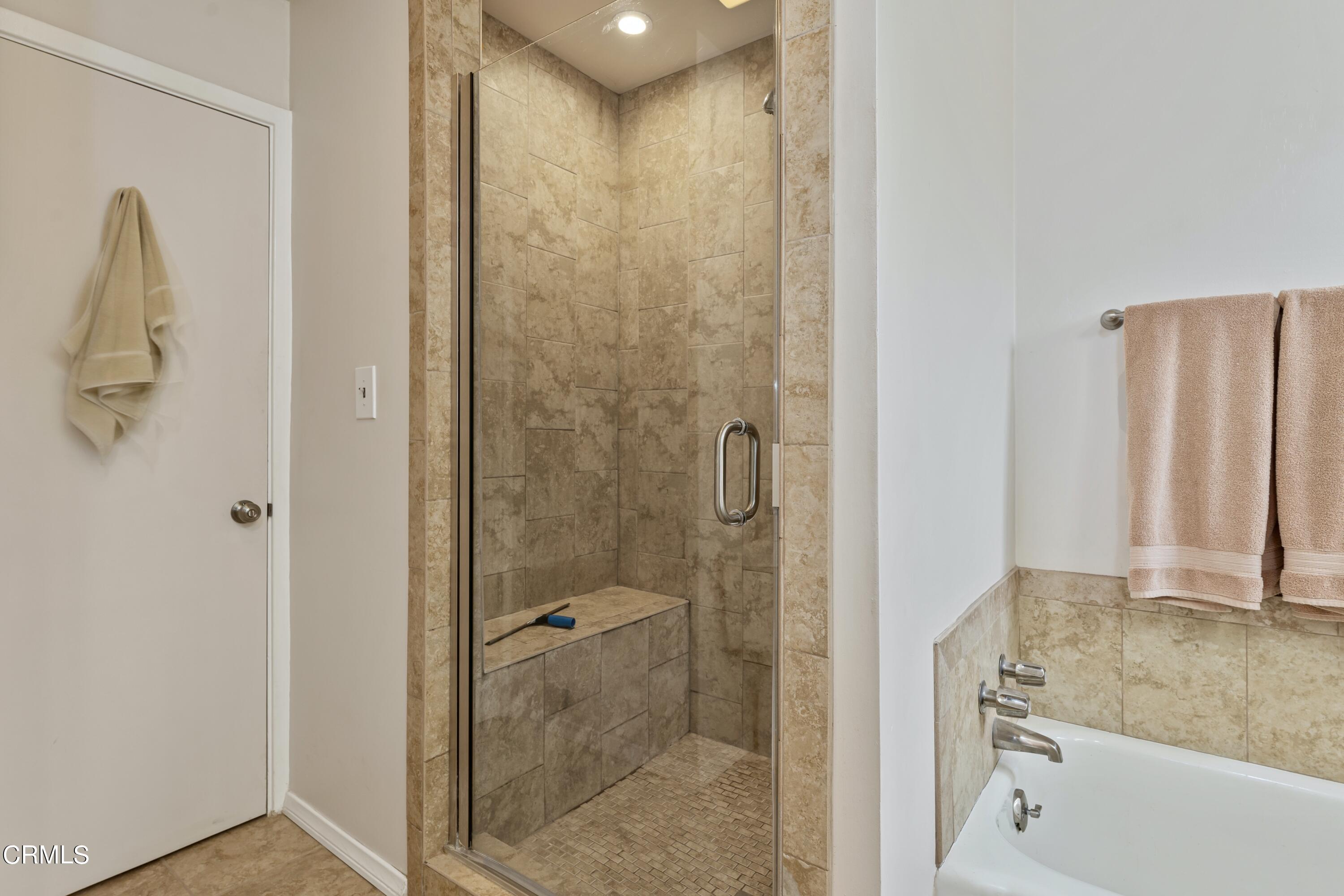 3850 Shadow Grove Road Pasadena, CA 91107 - Photo 32 of 53 a bathroom with a shower and a tub