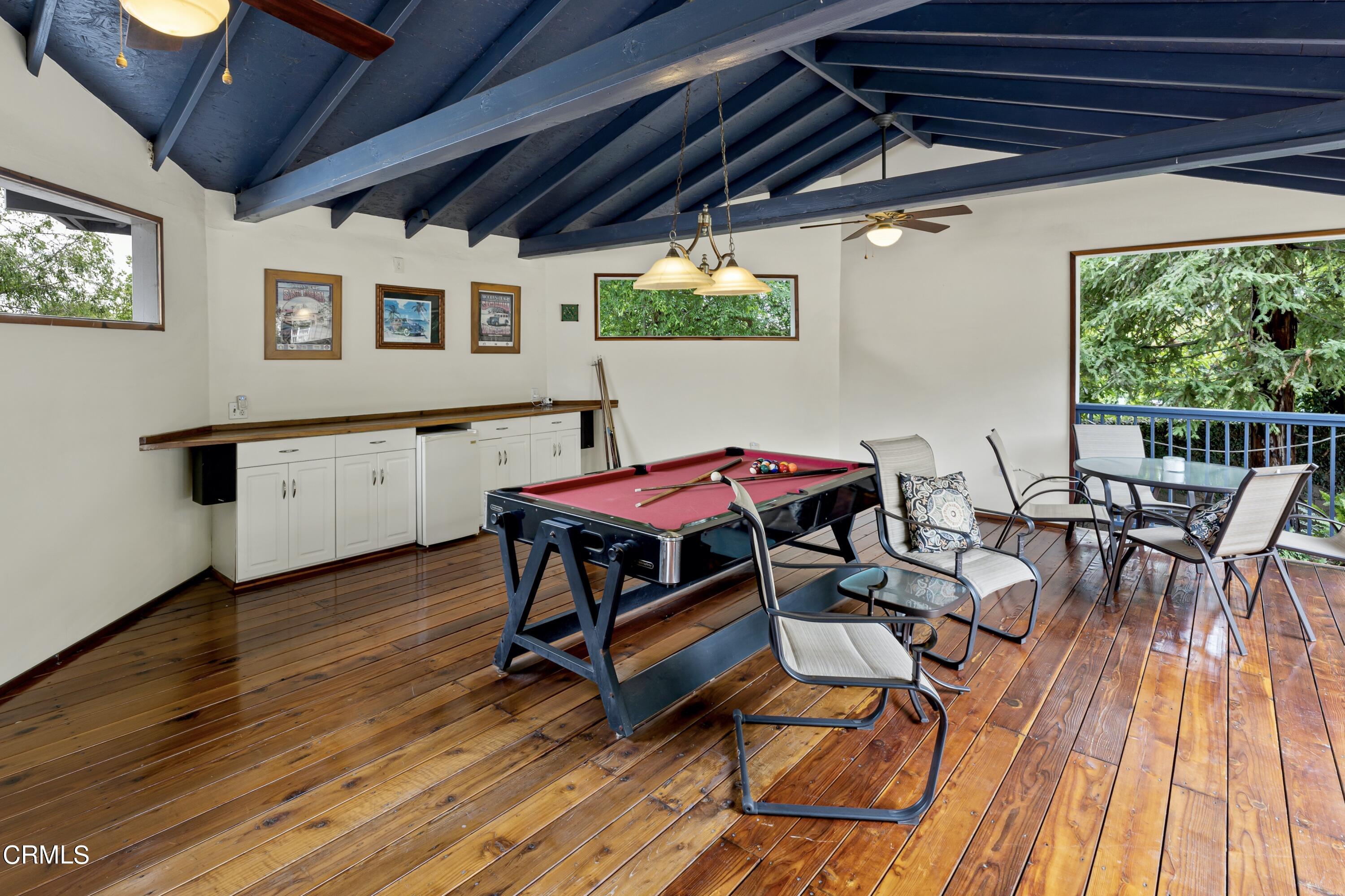 3850 Shadow Grove Road Pasadena, CA 91107 - Photo 41 of 53 a view of a patio with table and chairs with wooden floor and fence