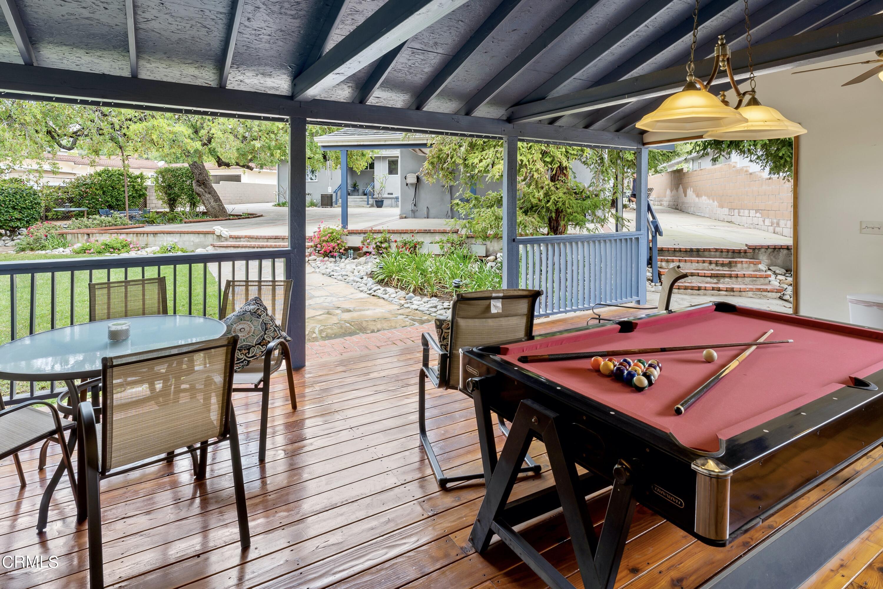 3850 Shadow Grove Road Pasadena, CA 91107 - Photo 42 of 53 a view of a patio with a table chairs and a table