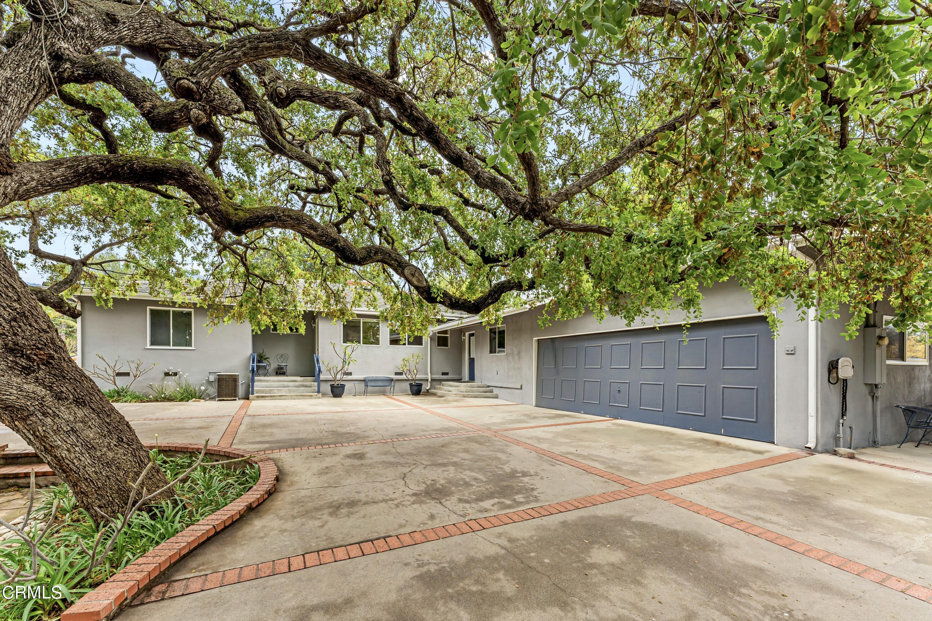 3850 Shadow Grove Road Pasadena, CA 91107 - Photo 47 of 53 a house with trees in front of it