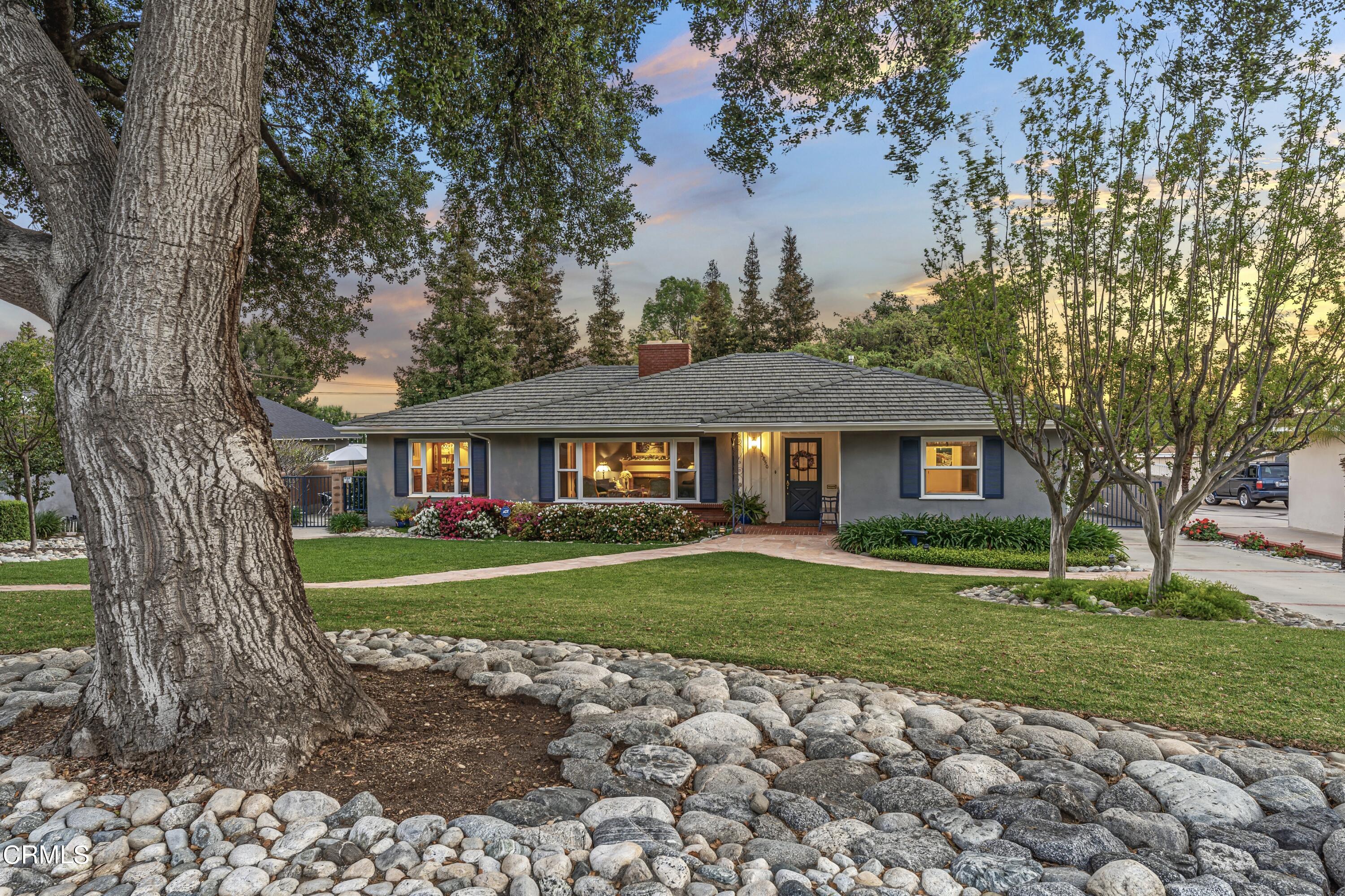 3850 Shadow Grove Road Pasadena, CA 91107 - Photo 5 of 53 a view of a big house with a big yard and large trees