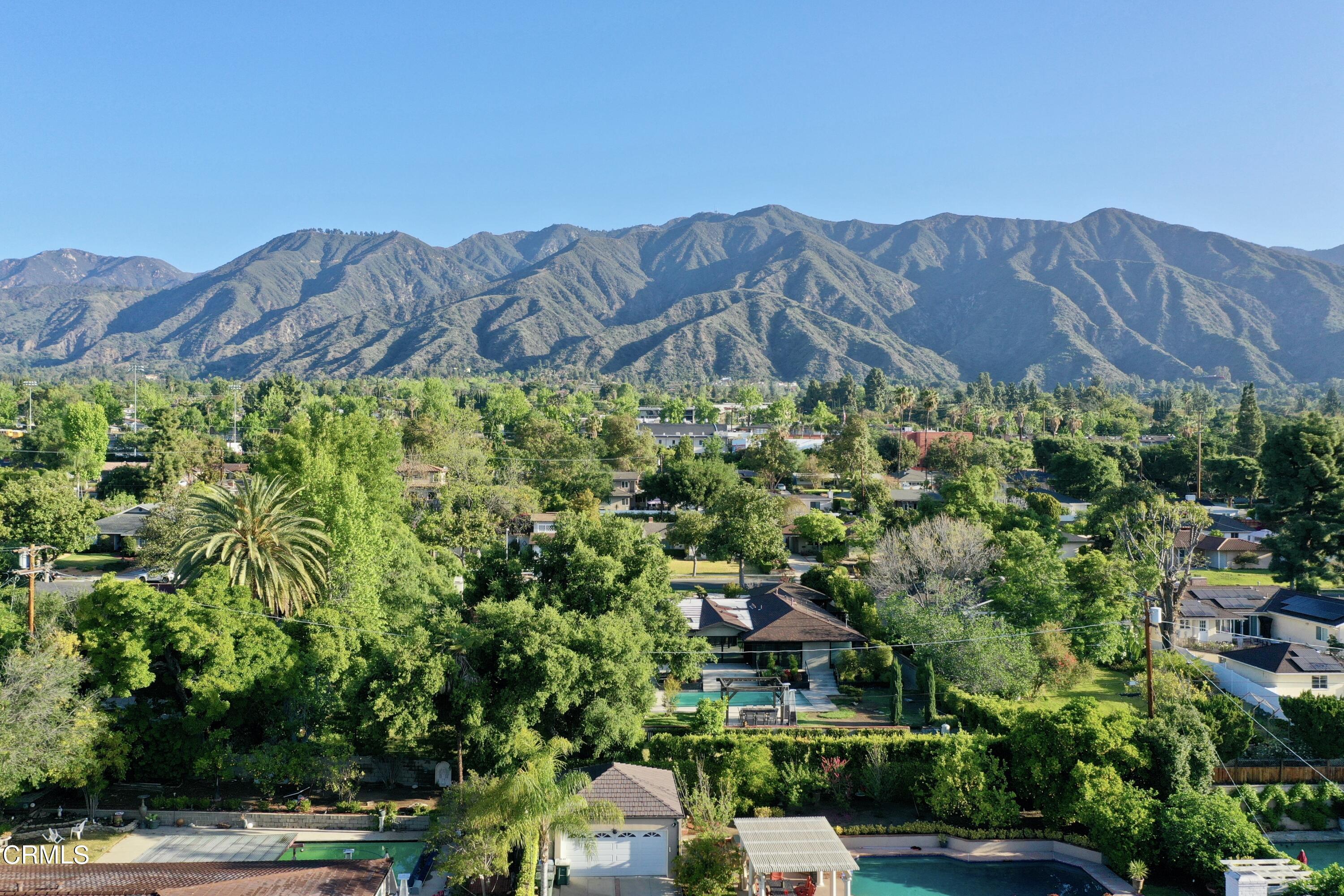 3850 Shadow Grove Road Pasadena, CA 91107 - Photo 52 of 53 a view of a lush green field with mountains in the background