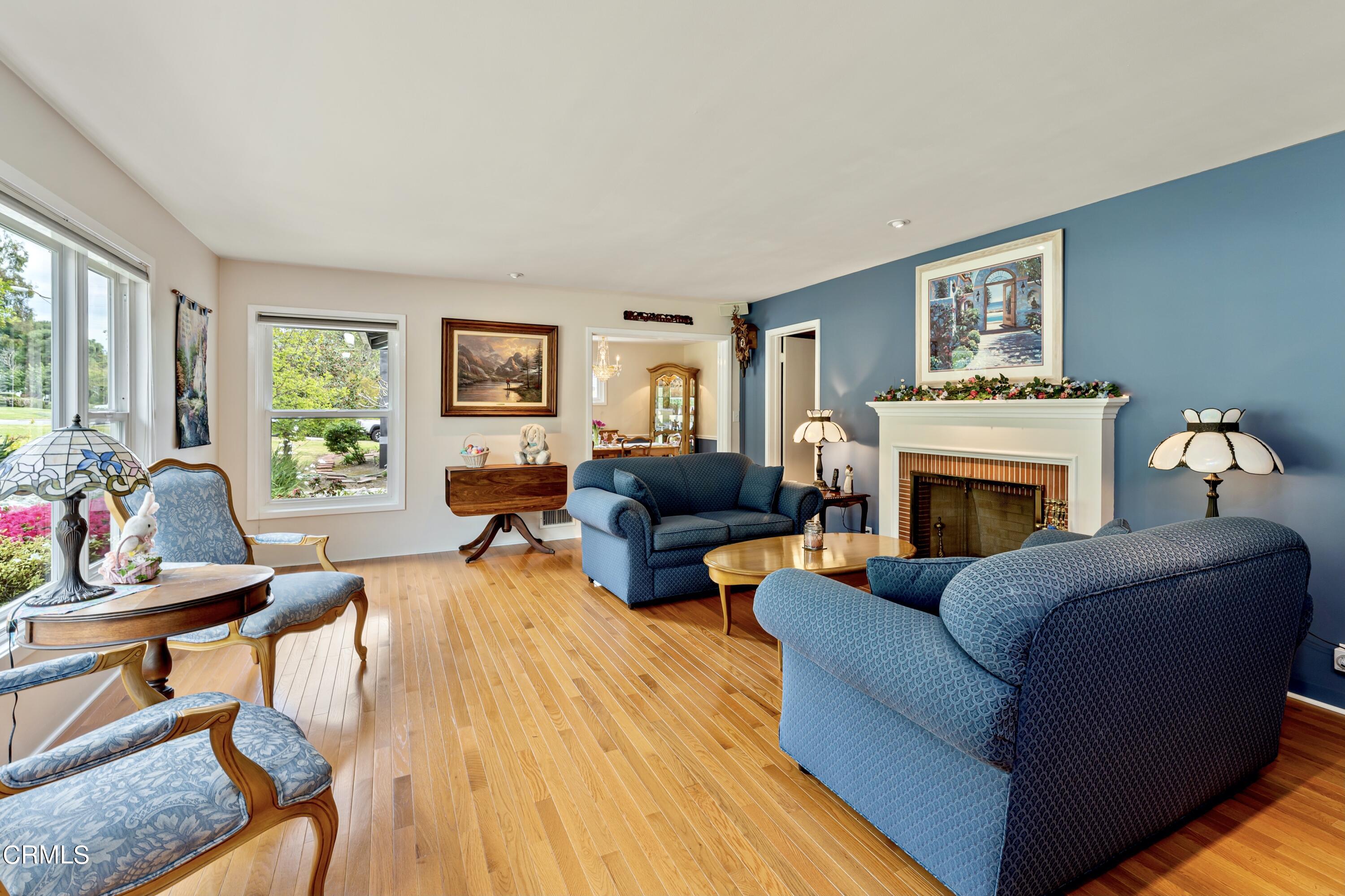3850 Shadow Grove Road Pasadena, CA 91107 - Photo 10 of 53 a living room with furniture a fireplace and a large window