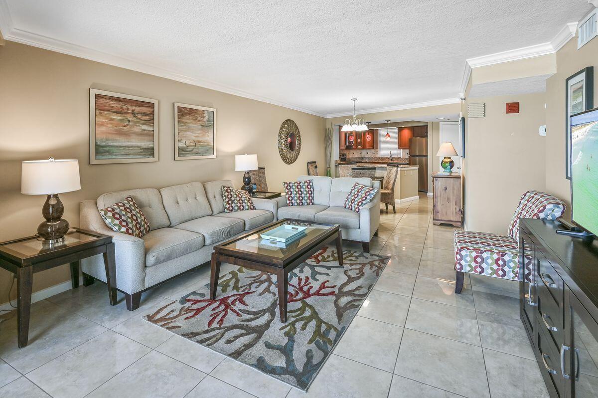 4252 Beachside 2, Unit 252 Miramar Beach, FL 32550 - Photo 11 of 27 a living room with furniture and a table