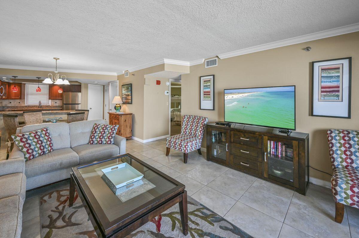 4252 Beachside 2, Unit 252 Miramar Beach, FL 32550 - Photo 12 of 27 a living room with furniture and a flat screen tv