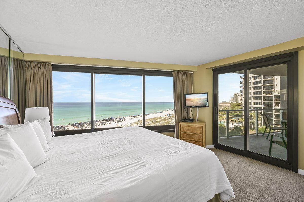 4252 Beachside 2, Unit 252 Miramar Beach, FL 32550 - Photo 14 of 27 a bedroom with a large bed and a large window with outer view