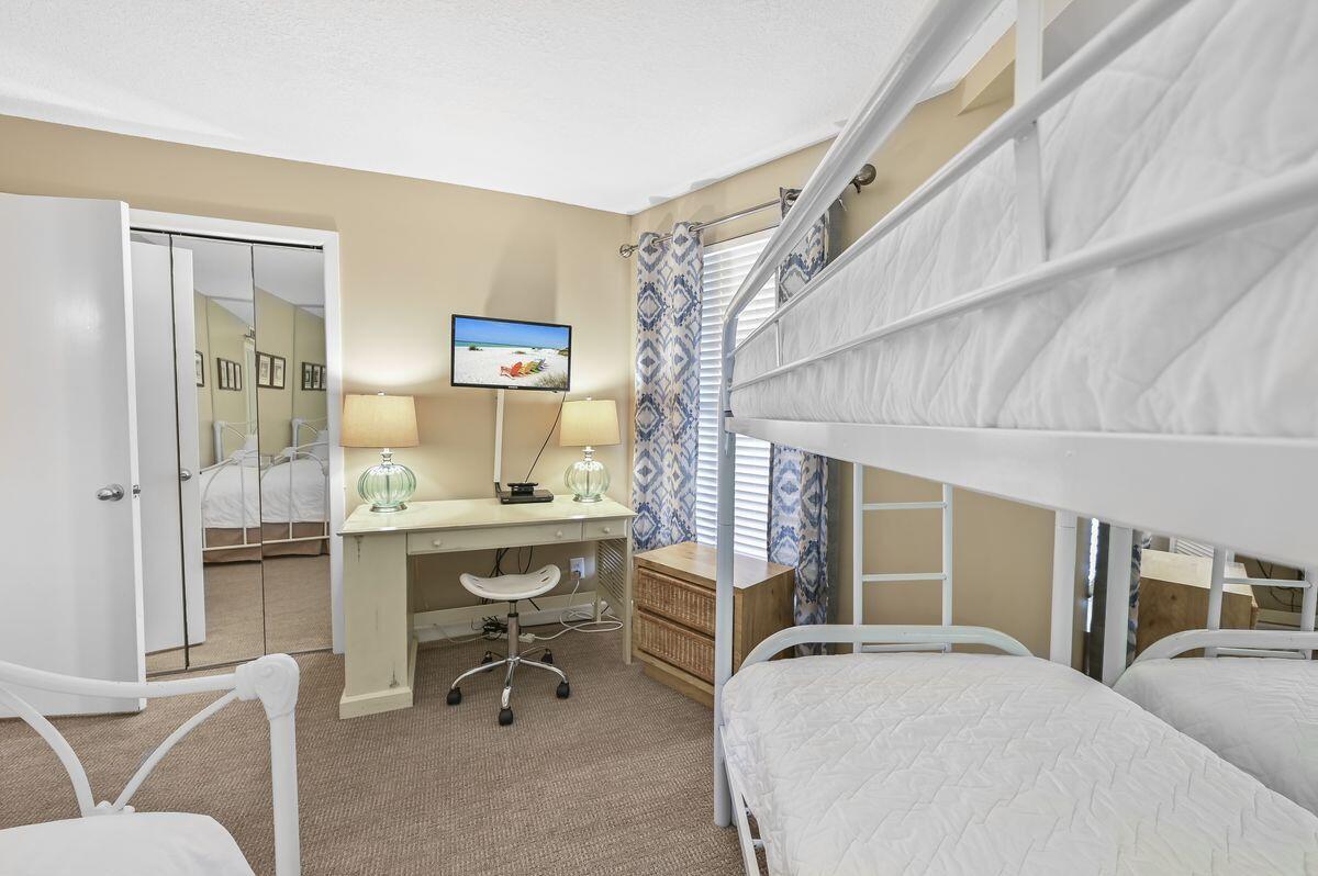 4252 Beachside 2, Unit 252 Miramar Beach, FL 32550 - Photo 18 of 27 a bedroom with furniture and a window