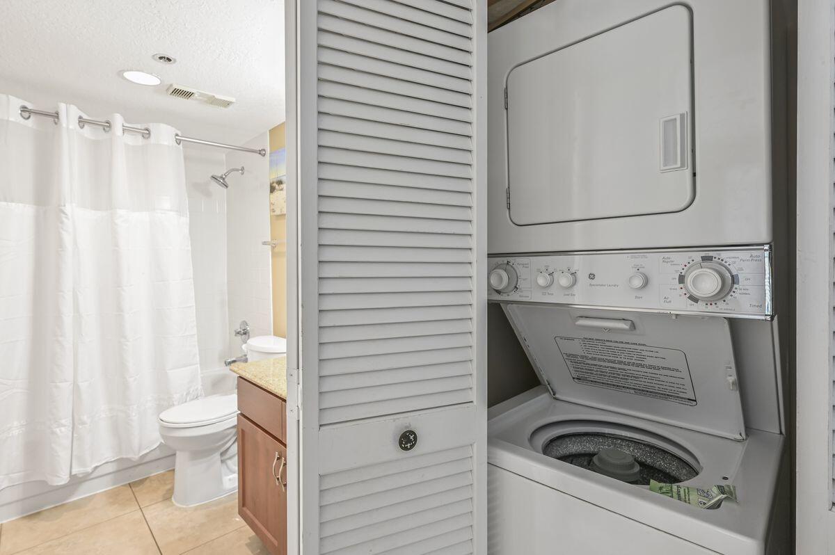 4252 Beachside 2, Unit 252 Miramar Beach, FL 32550 - Photo 20 of 27 a bathroom with a sink a toilet and a mirror