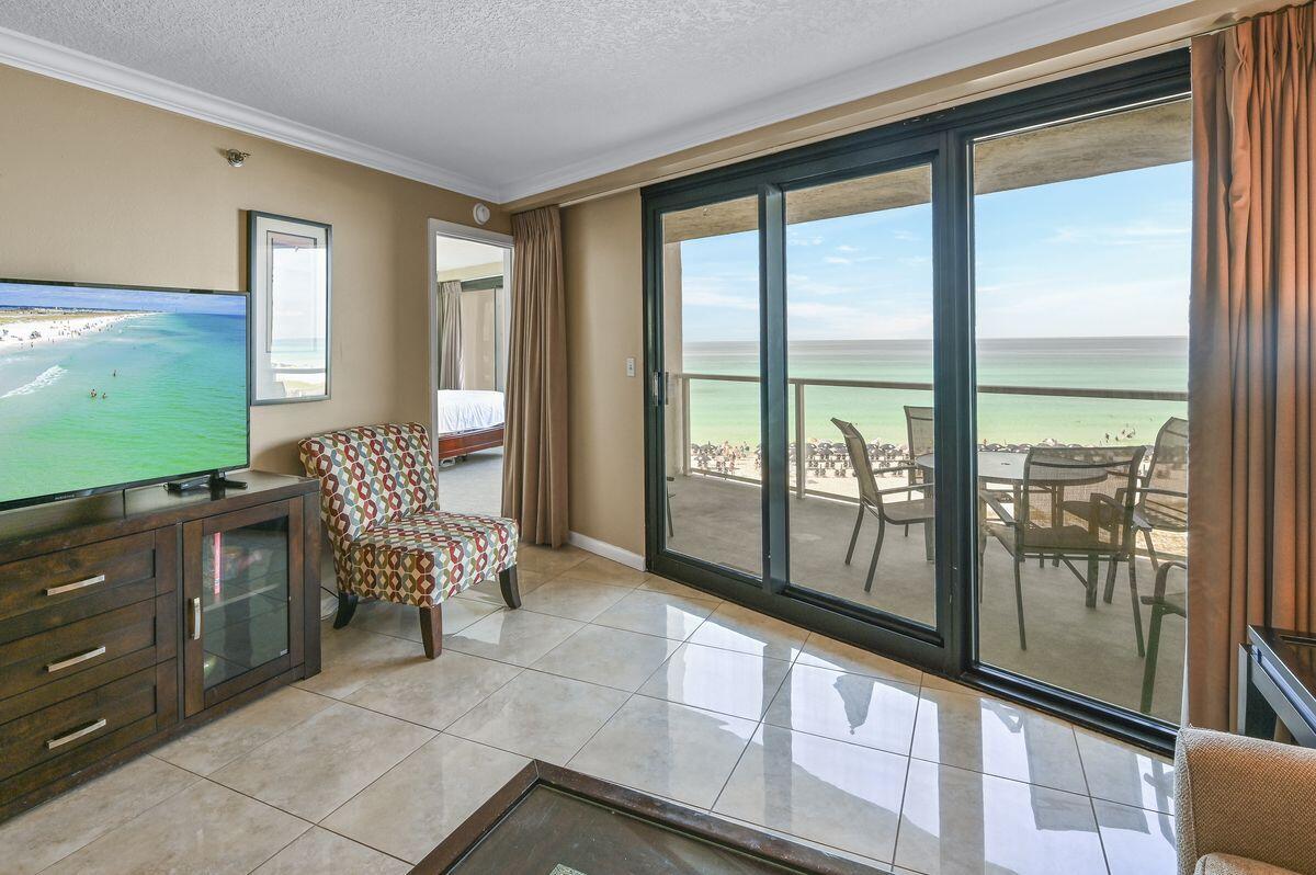 4252 Beachside 2, Unit 252 Miramar Beach, FL 32550 - Photo 2 of 27 a living room with furniture and a flat screen tv