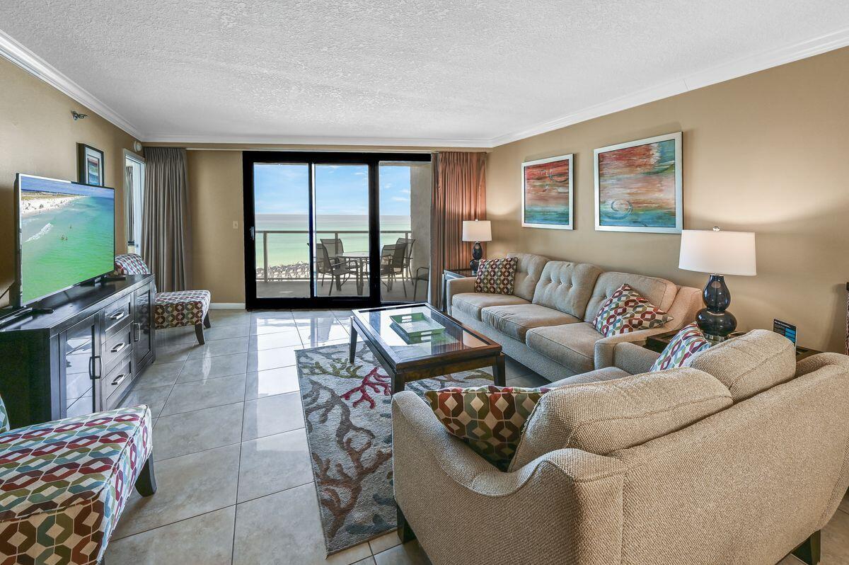 4252 Beachside 2, Unit 252 Miramar Beach, FL 32550 - Photo 3 of 27 a living room with furniture and a flat screen tv