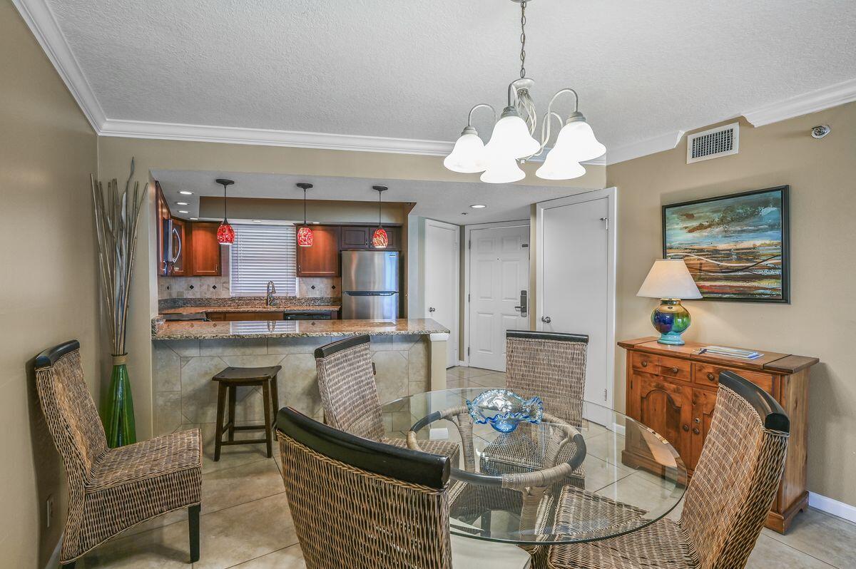 4252 Beachside 2, Unit 252 Miramar Beach, FL 32550 - Photo 9 of 27 a living room with granite countertop furniture and a large window