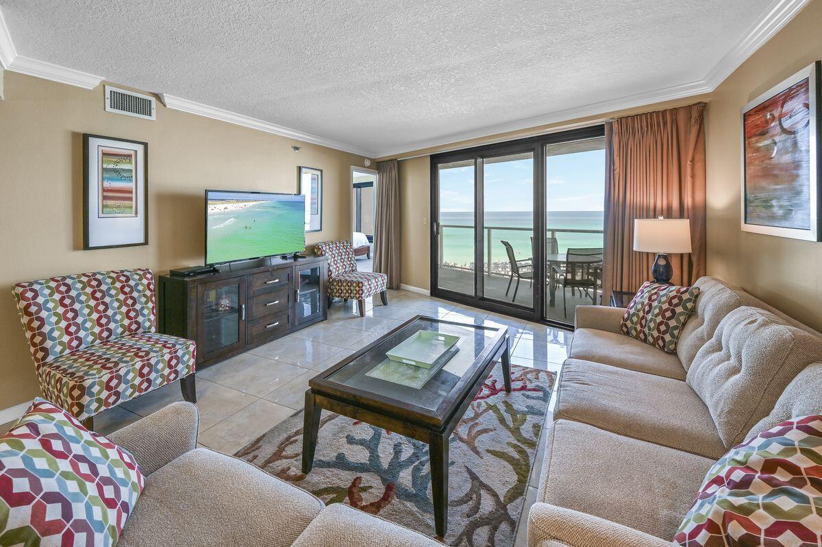 4252 Beachside 2, Unit 252 Miramar Beach, FL 32550 - Photo 10 of 27 a living room with furniture and a flat screen tv