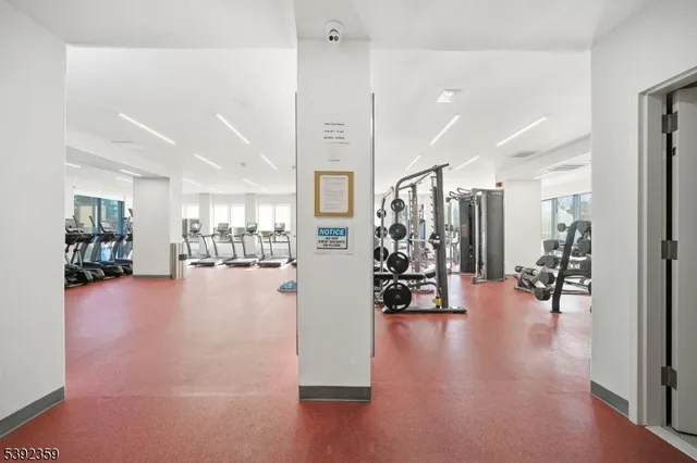 a view of livingroom and dining room with furniture and wooden floor