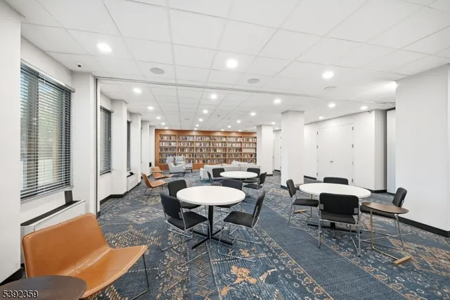 a living room with furniture a rug and a chandelier
