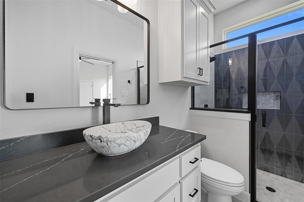 112 La Paloma Way Decatur, TX 76234 - Photo 28 of 37 Bathroom with a stall shower and vanity