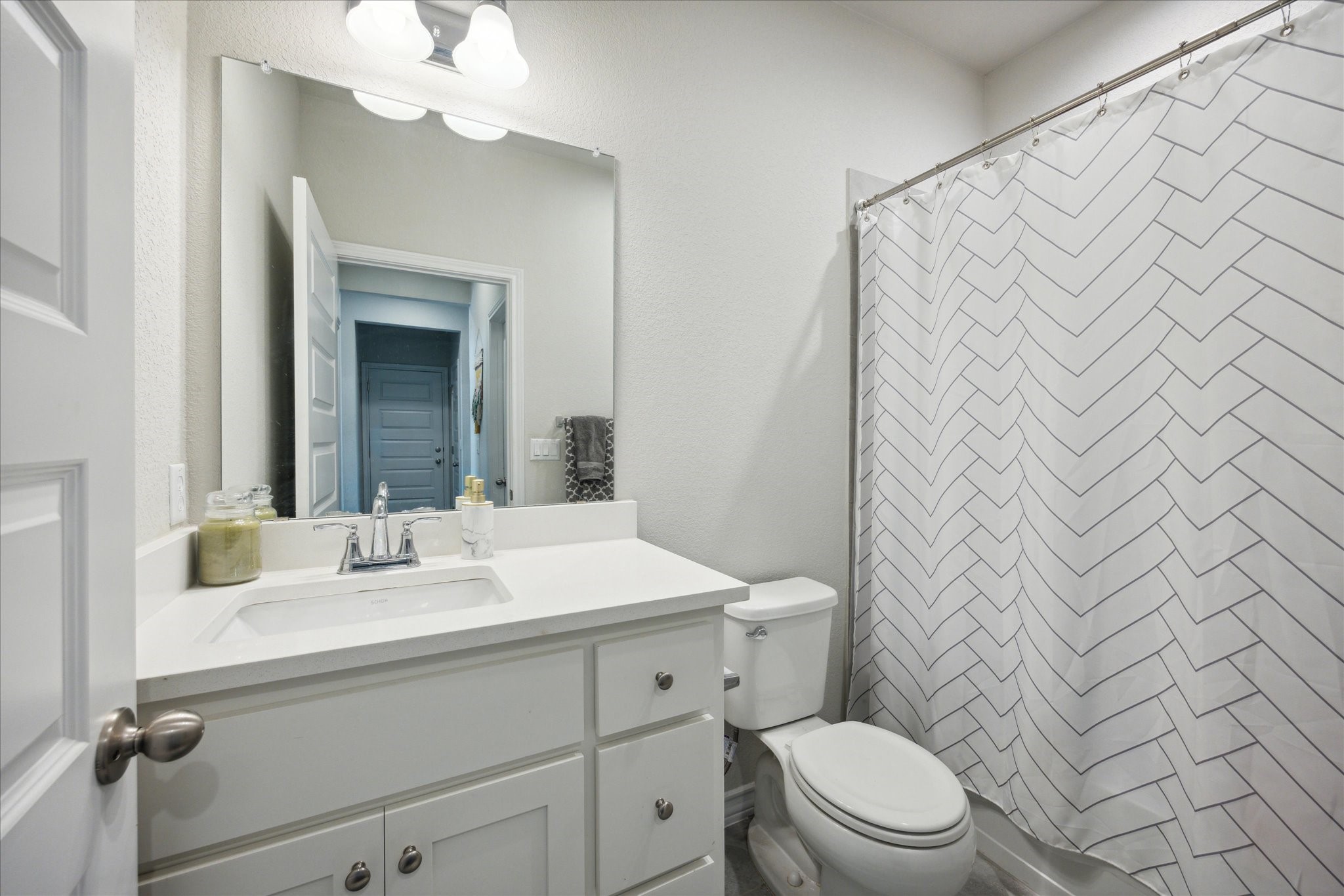 2005 Jacey Way Austin, TX 78725 - Photo 8 of 17 Full bathroom next to downstairs bedroom