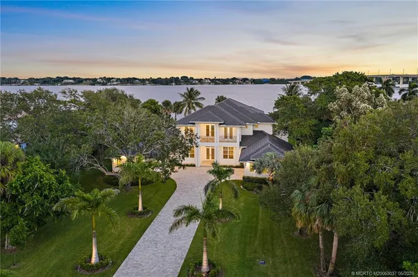 an aerial view of a house with a ocean view