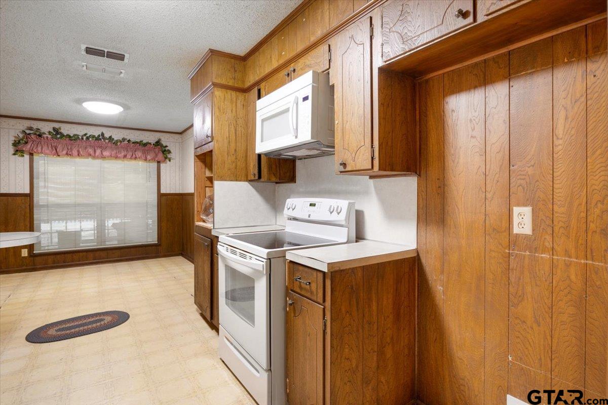 1302 Jeb Stuart Drive Tyler, TX 75703 - Photo 13 of 47 a utility room with dryer and washer