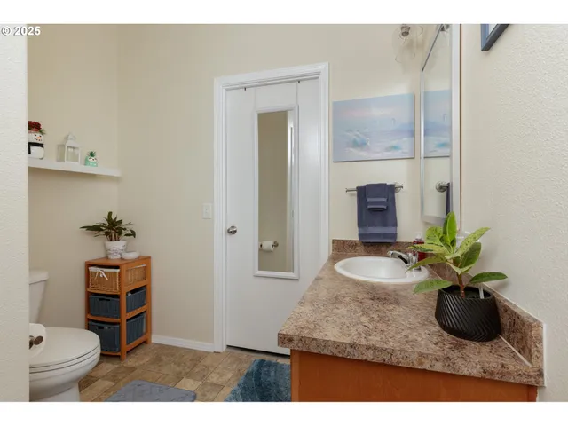 a room with sink and mirror