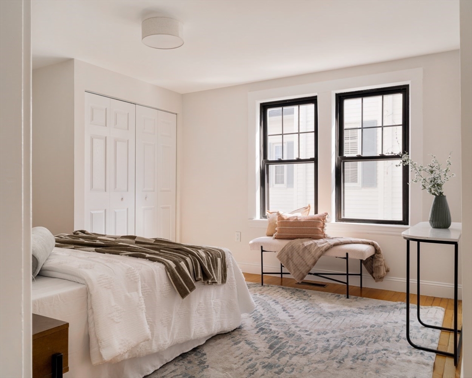 10 Washington Avenue, Unit 2 Waltham, MA 02453 - Photo 15 of 26 a bedroom with bed and a window
