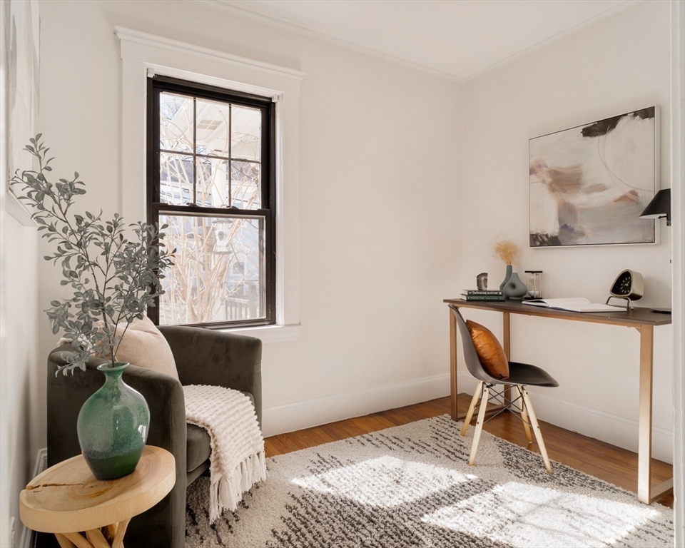 10 Washington Avenue, Unit 2 Waltham, MA 02453 - Photo 2 of 26 a living room with furniture and a window