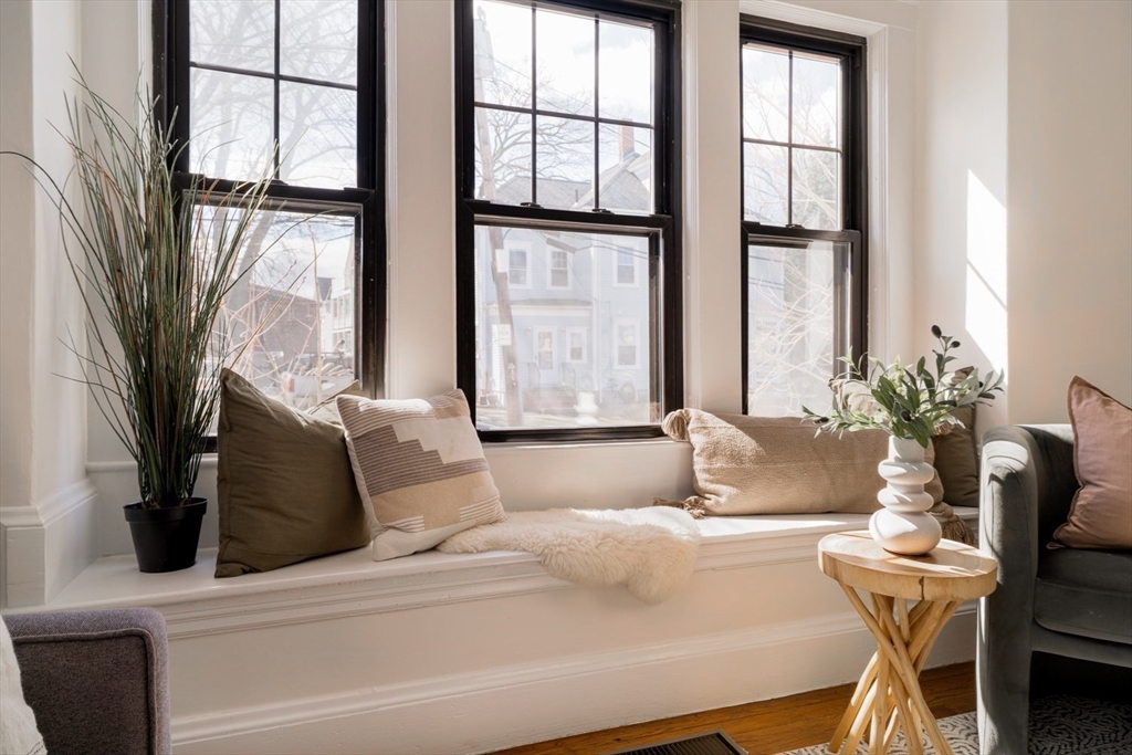 10 Washington Avenue, Unit 2 Waltham, MA 02453 - Photo 6 of 26 a living room with furniture and a large window