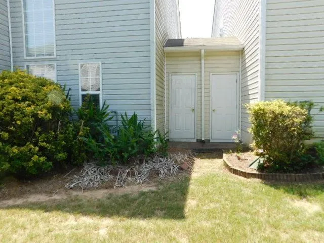 a view of a garden with a chair