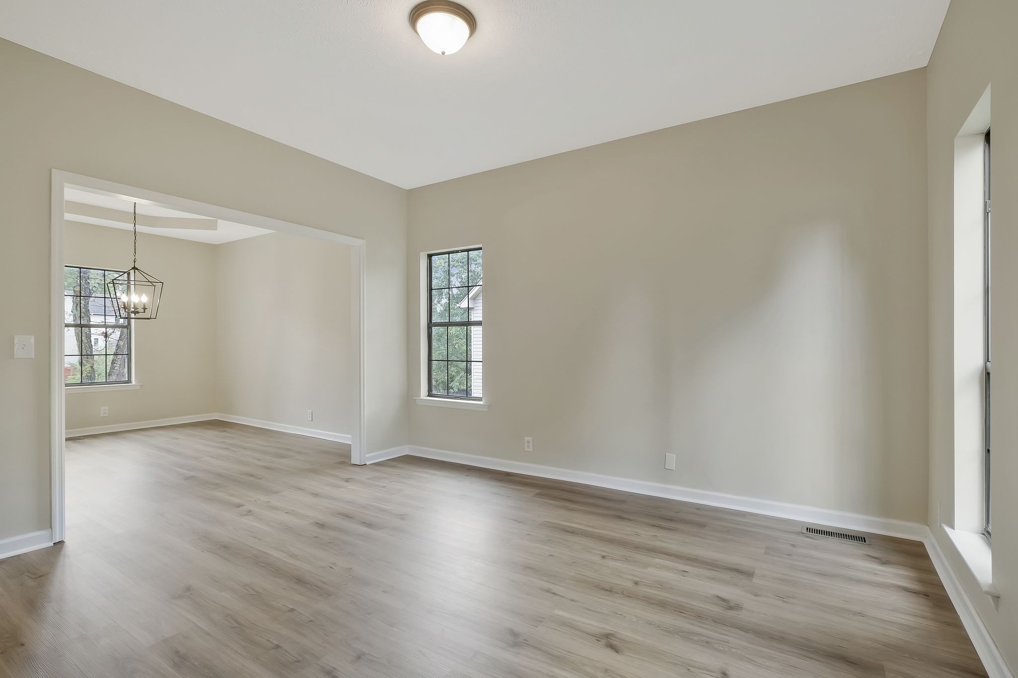 Formal living room with great light could also be used as a study or den.