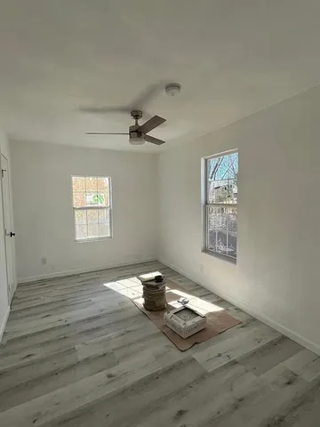 a view of an empty room and window