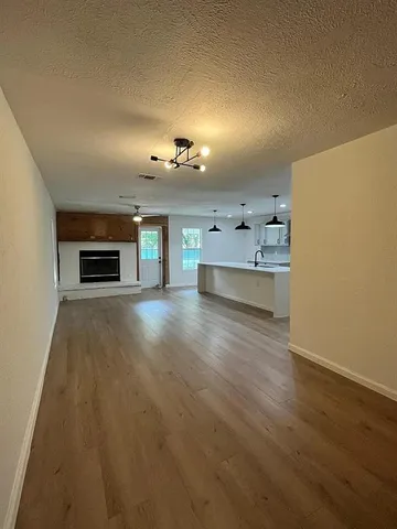 a view of a livingroom with furniture and a fireplace