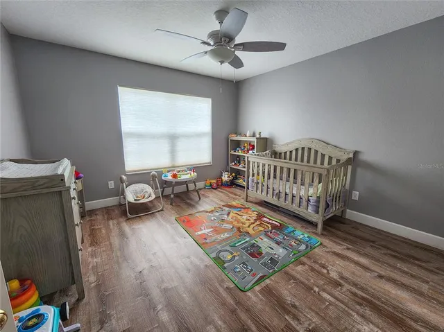 a living room with furniture a rug and a window