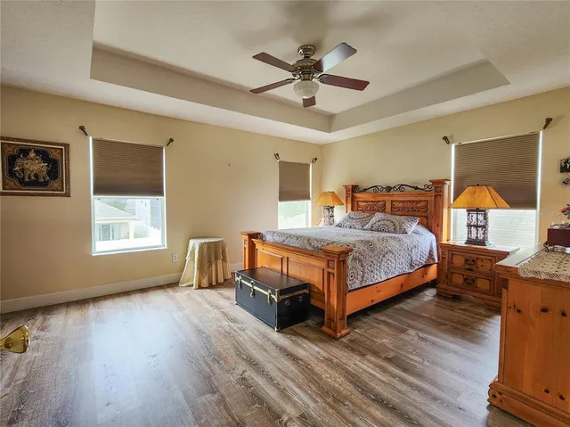 a bedroom with a bed and a table