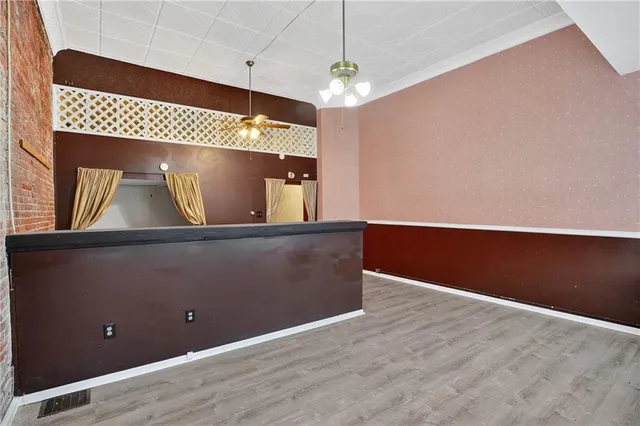 en view of room with window and wooden floor