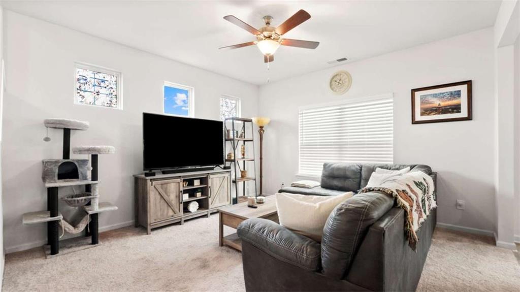 13 Maycroft Court Rome, GA 30161 - Photo 12 of 28 a living room with furniture and a flat screen tv
